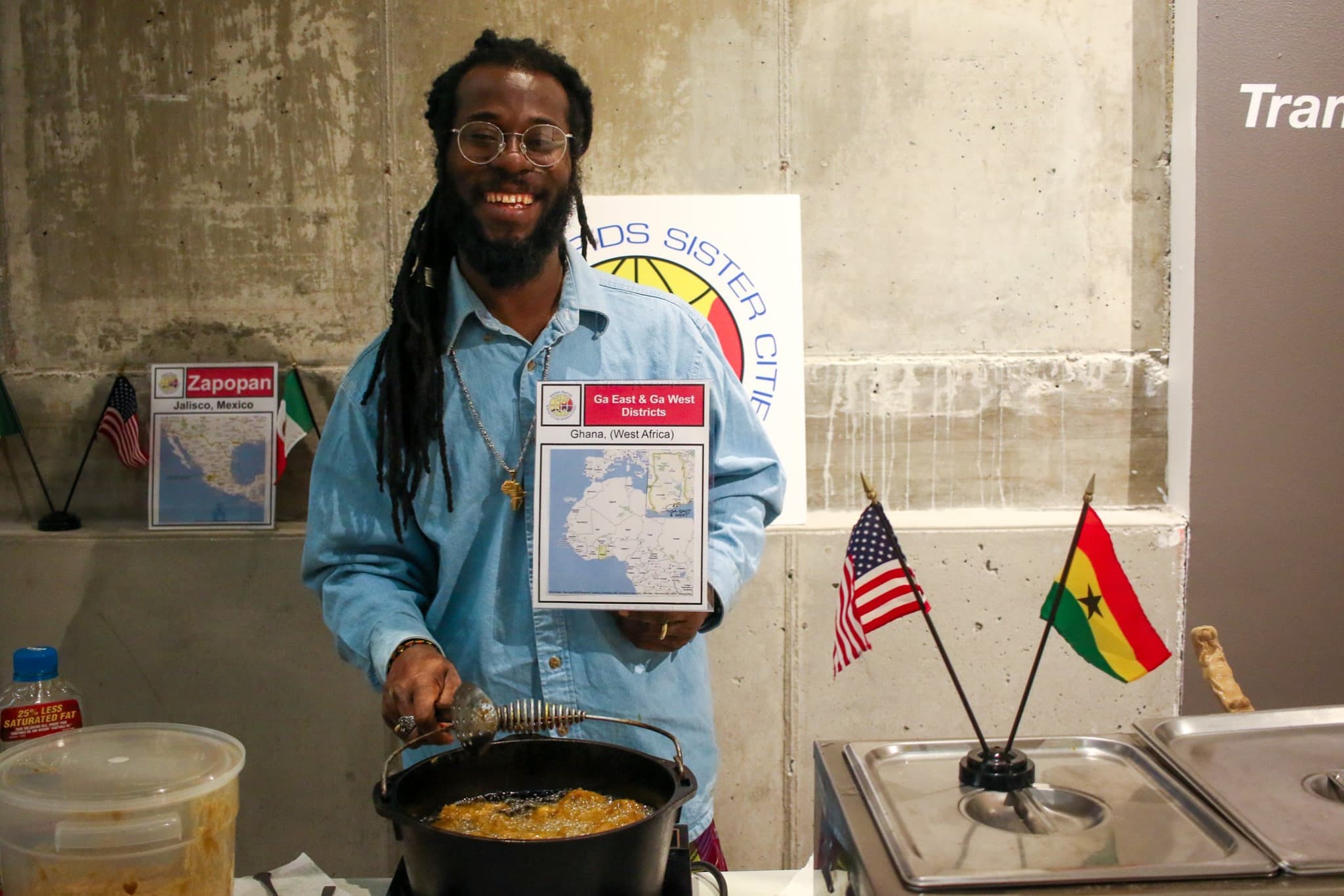 Man serving West African cuisine